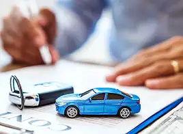 Car Loan Contract with Car Key and Toy Car