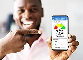 Smiling Man Holding Phone Showing Credit Score