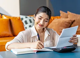 Smiling Woman Taking Notes