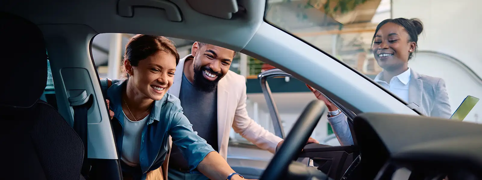 Happy Couple Looking at a Car