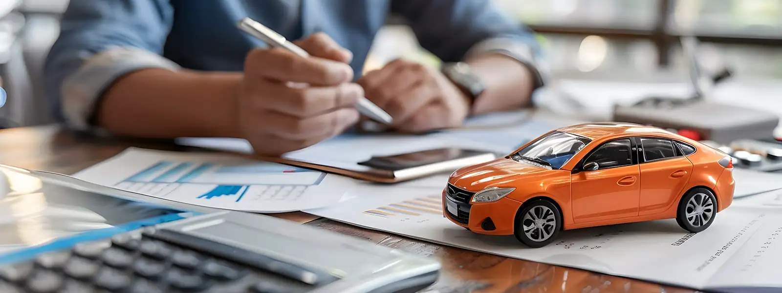 Man Signing an Auto Loan